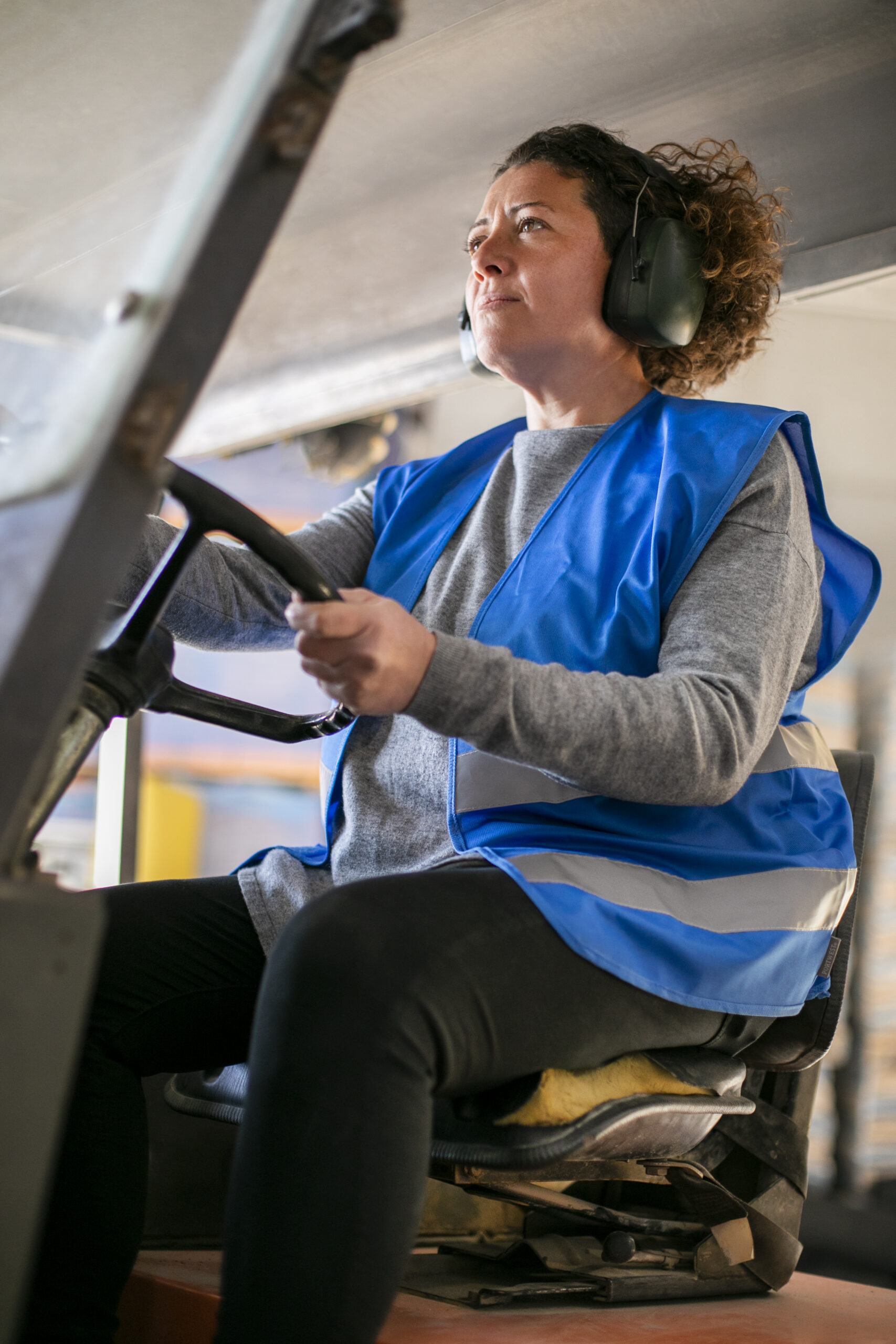 professional-female-driver-operating-forklift-vehicle